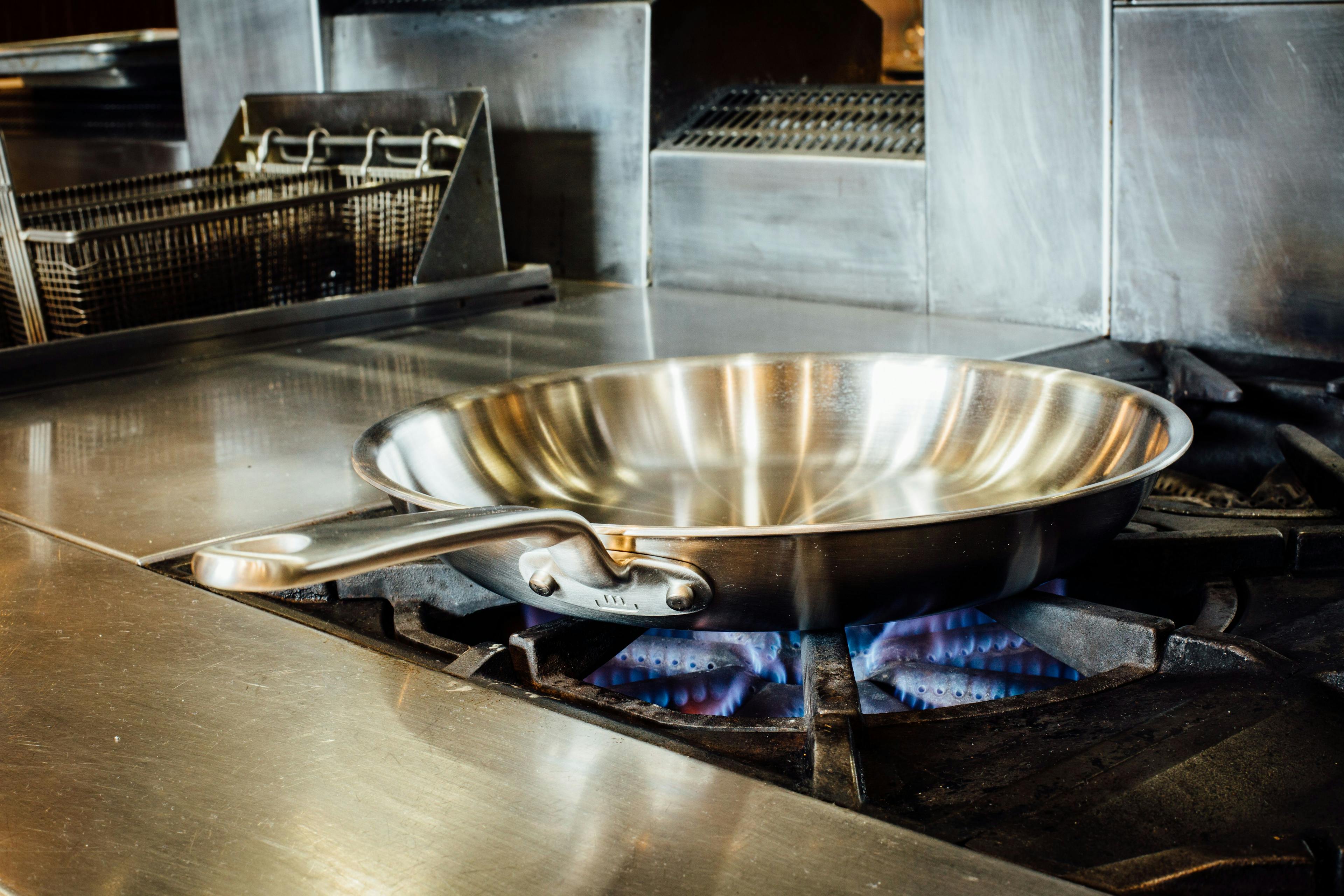 Stainless clad frying pan on stove